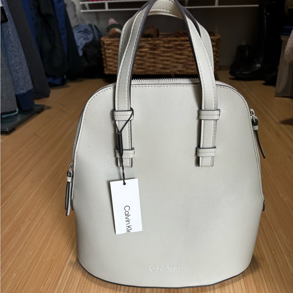 New with tags Calvin Cline backpack. Nice versatile bag with a great color.